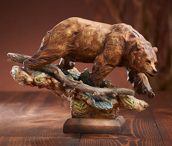 Taking The Lead Grizzly Bear sculpture from Mill Creek on Wild Wings features a detailed grizzly walking across a rugged, branch-like base.