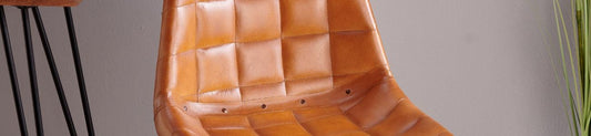 An orange, quilted leather chair.
